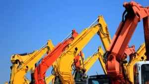A group of construction machines. The question is What Is an Equipment Loan and When to Use It?