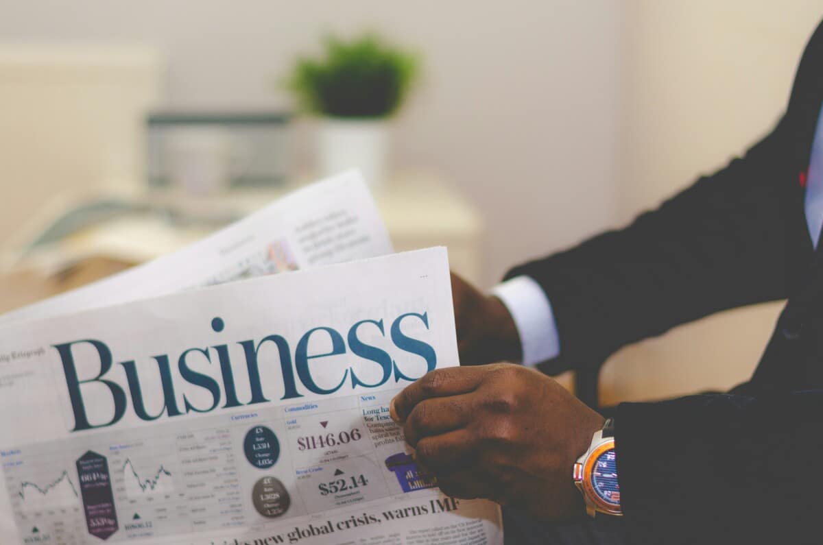 business newspaper describing merchant cash advance vs business loan: key differences